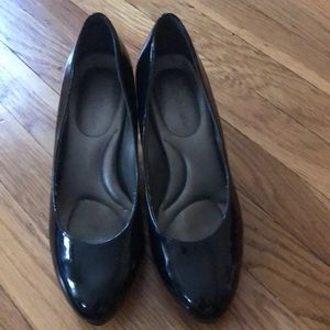 Black patent leather heels.